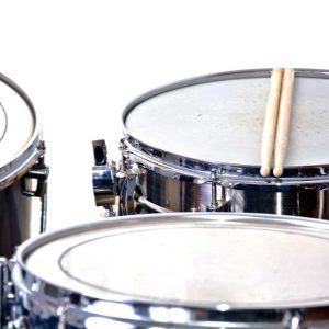 Drums over isolated white background. Music conceptual image. Snare toms and cymbals.